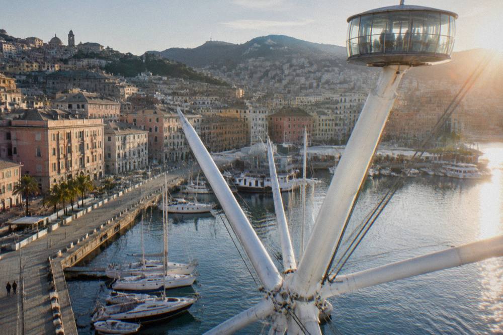 The circular cabin of the Bigo lift seen from the harbour quays with moored boats below