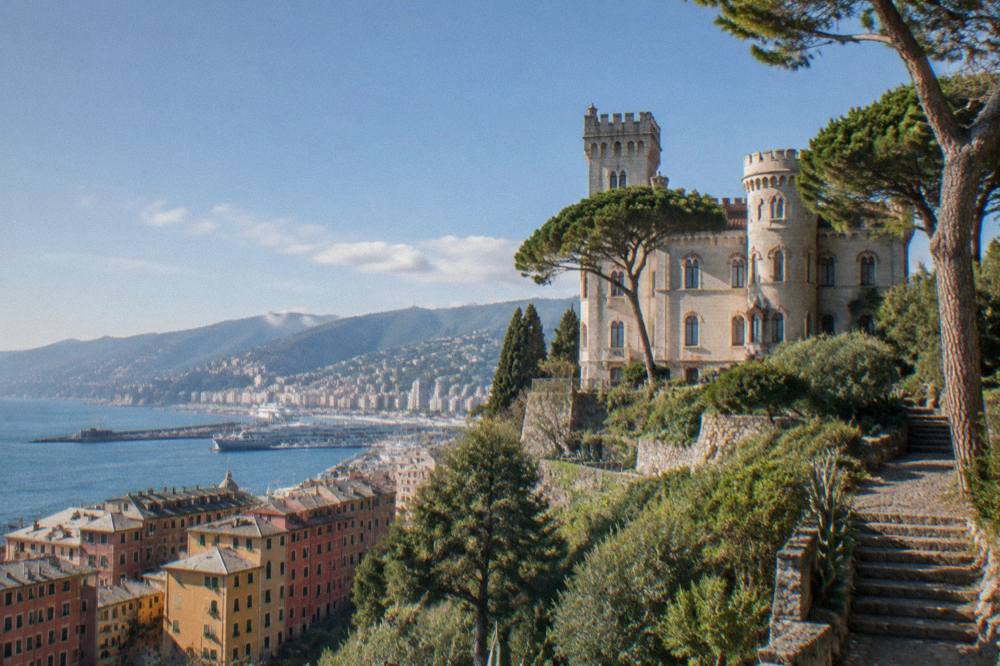 Colourful seaside villages on a rocky Ligurian coastline seen from the water