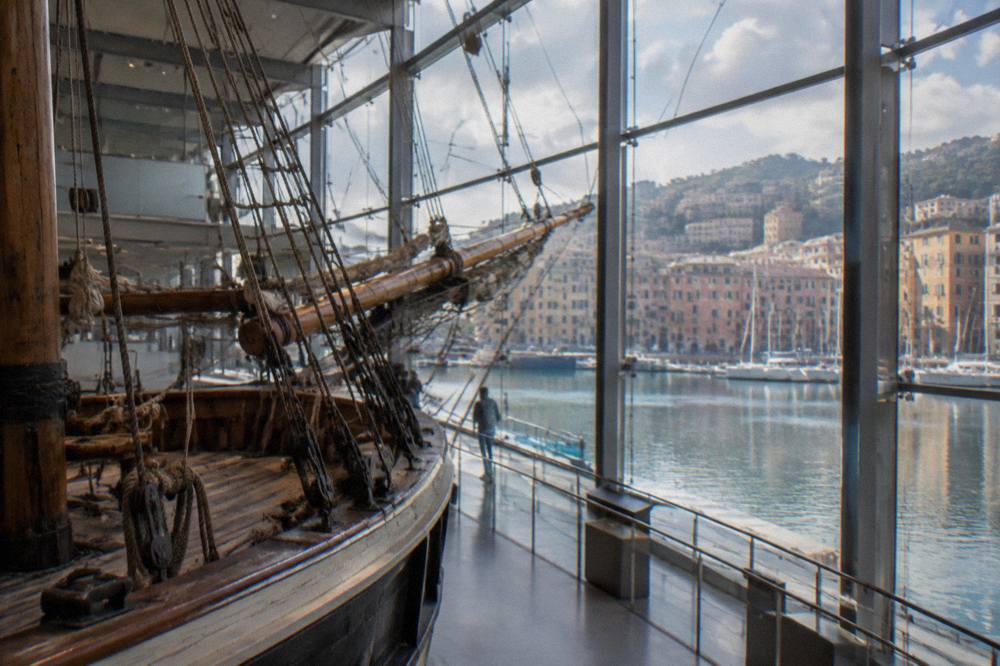 A restored sailing ship rigging display inside a spacious museum hall