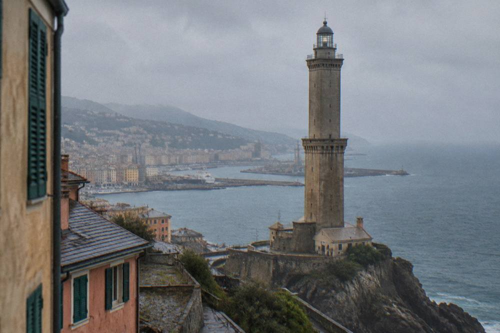 Close view of the Lanterna's stone tower with its lantern gallery at the top