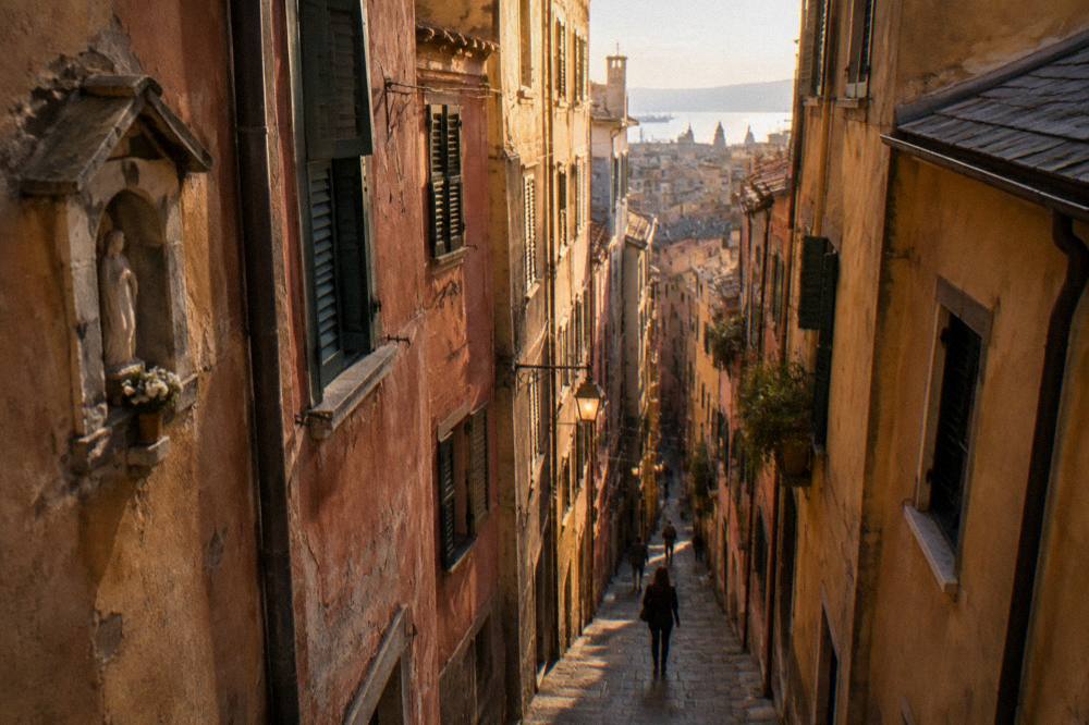 Narrow caruggi lane in Genoa's medieval old town with tall painted buildings
