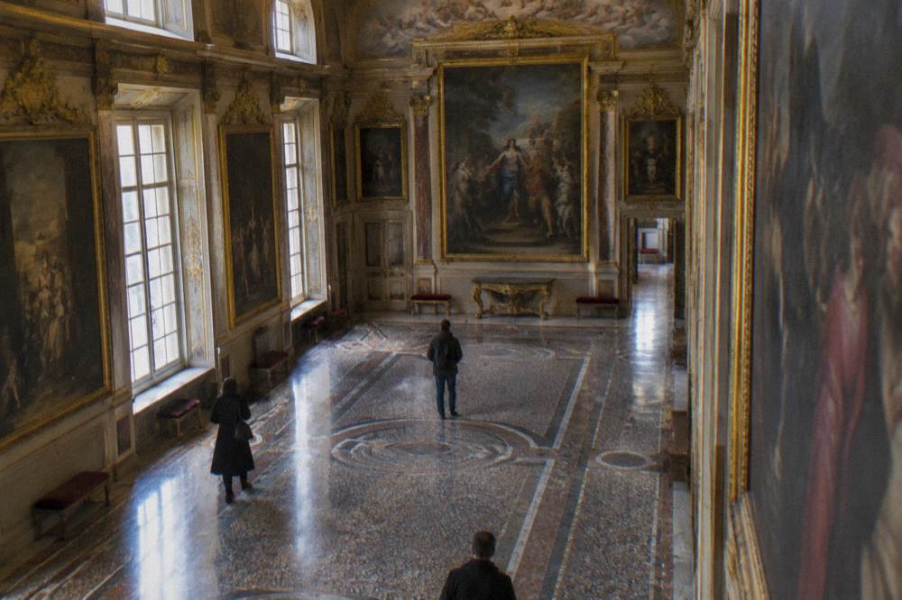 Paintings and gilded stucco in a palace gallery in Genoa
