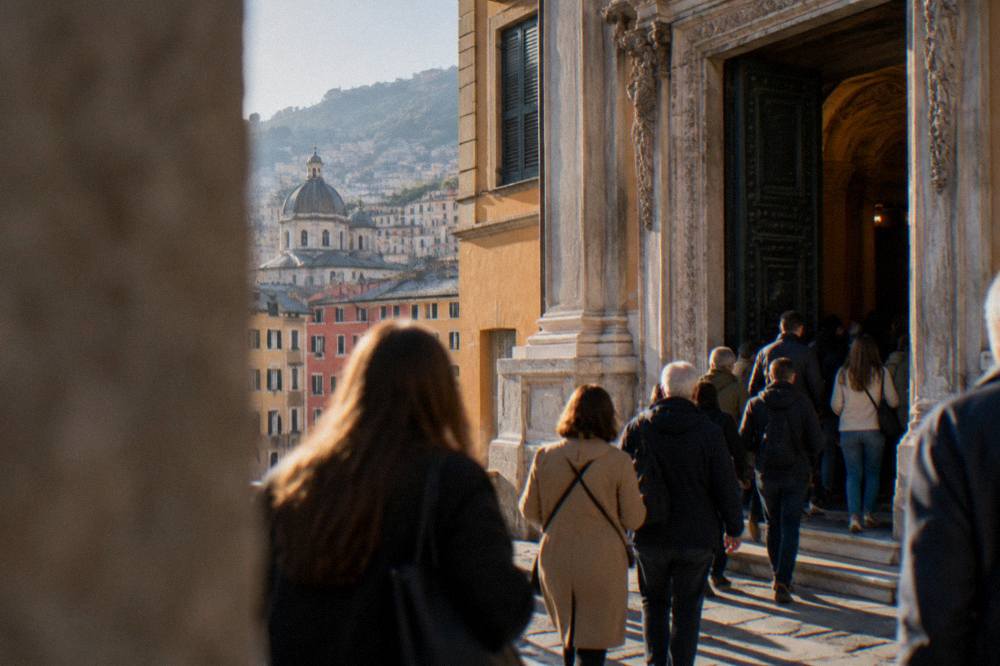 Crowds entering an ornate palace doorway during an open-days event in Genoa