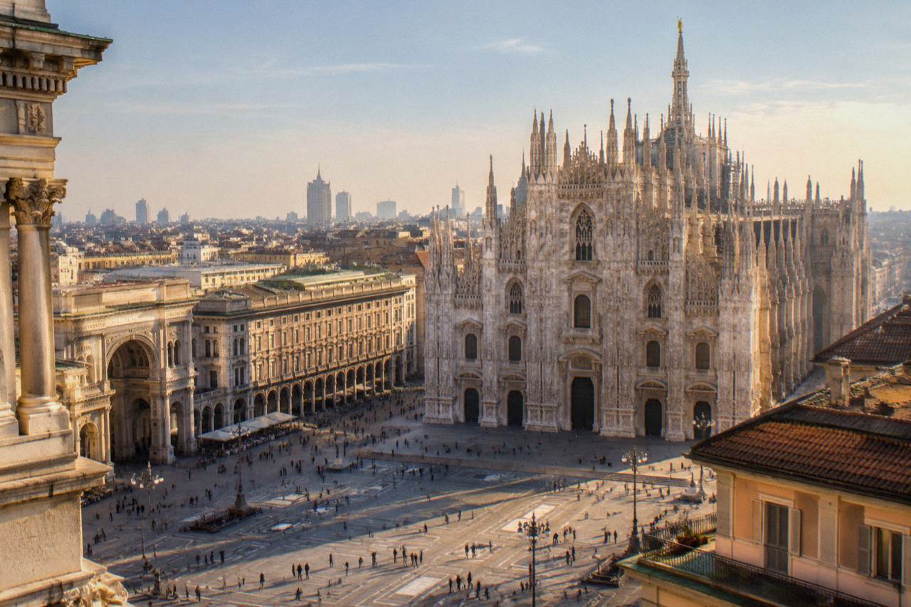 The Duomo of Milan rising above the rooftops of the city centre