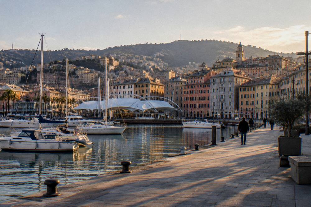 Evening light on the harbour buildings of the Porto Antico in Genoa