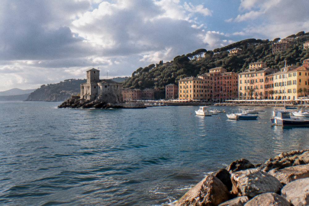 The rocky coastline and wooded headland seen from the sea near Rapallo