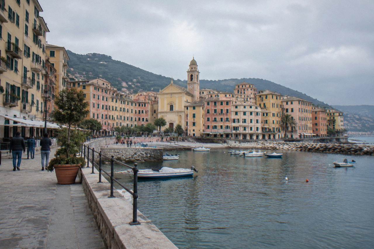 The seaside town of Recco on the Ligurian coast with apartment buildings rising behind a small harbour
