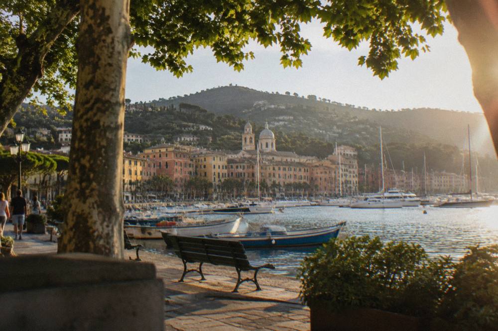 Fishing boats and yachts moored in the harbour of Santa Margherita Ligure with hills behind