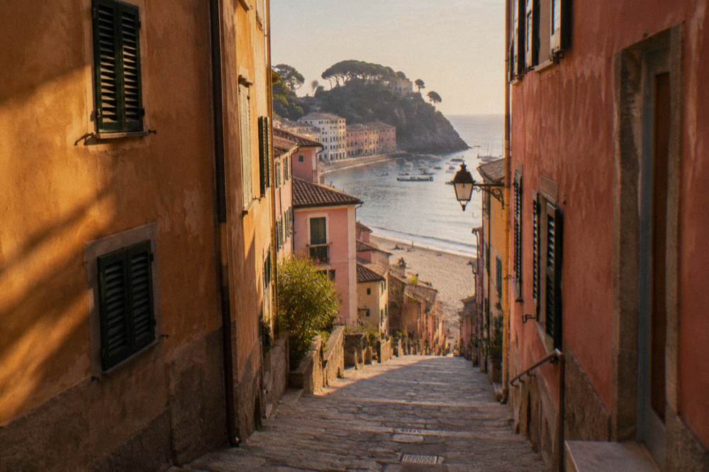 A narrow old-town lane in Sestri Levante with shuttered houses in warm colours