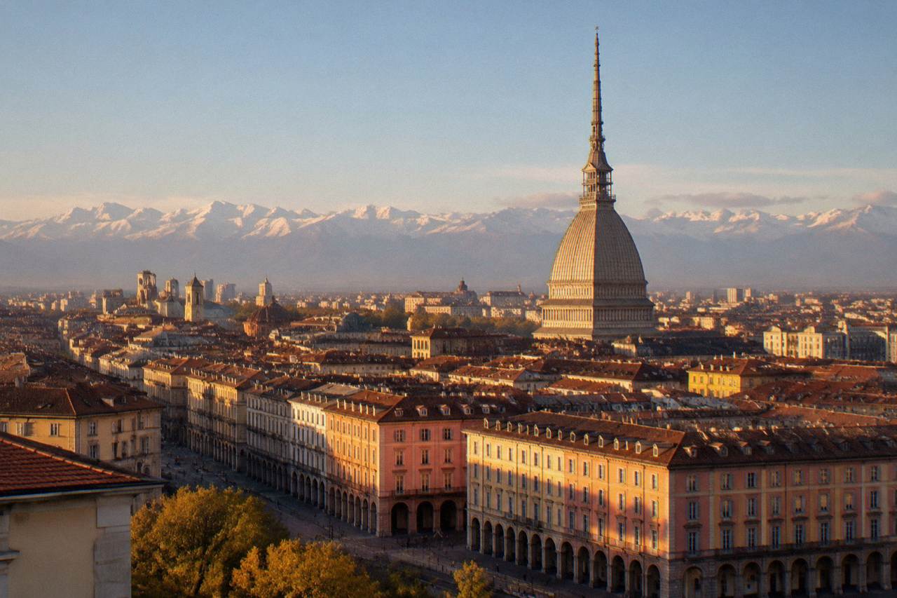 Turin city skyline with the Mole Antonelliana tower rising above rooftops on a clear day