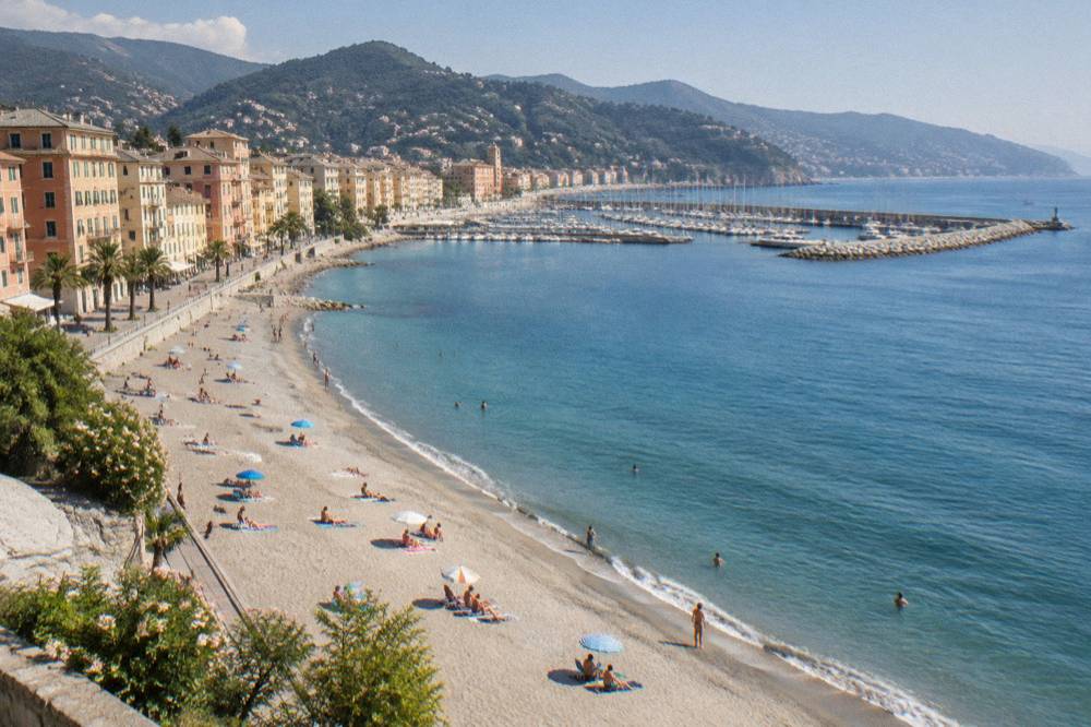 People relaxing on a sandy beach beside a calm Mediterranean sea