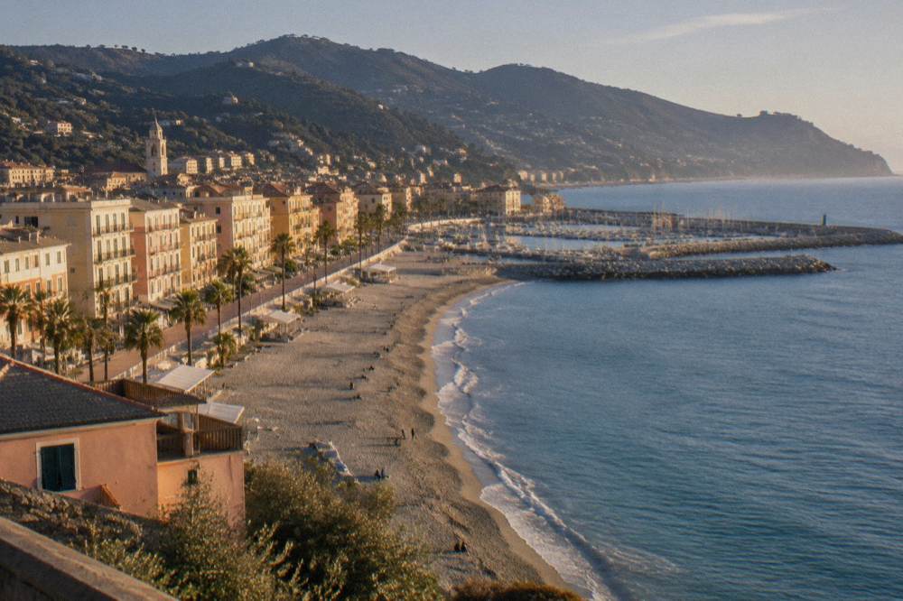 Golden evening light over a Mediterranean beach town waterfront