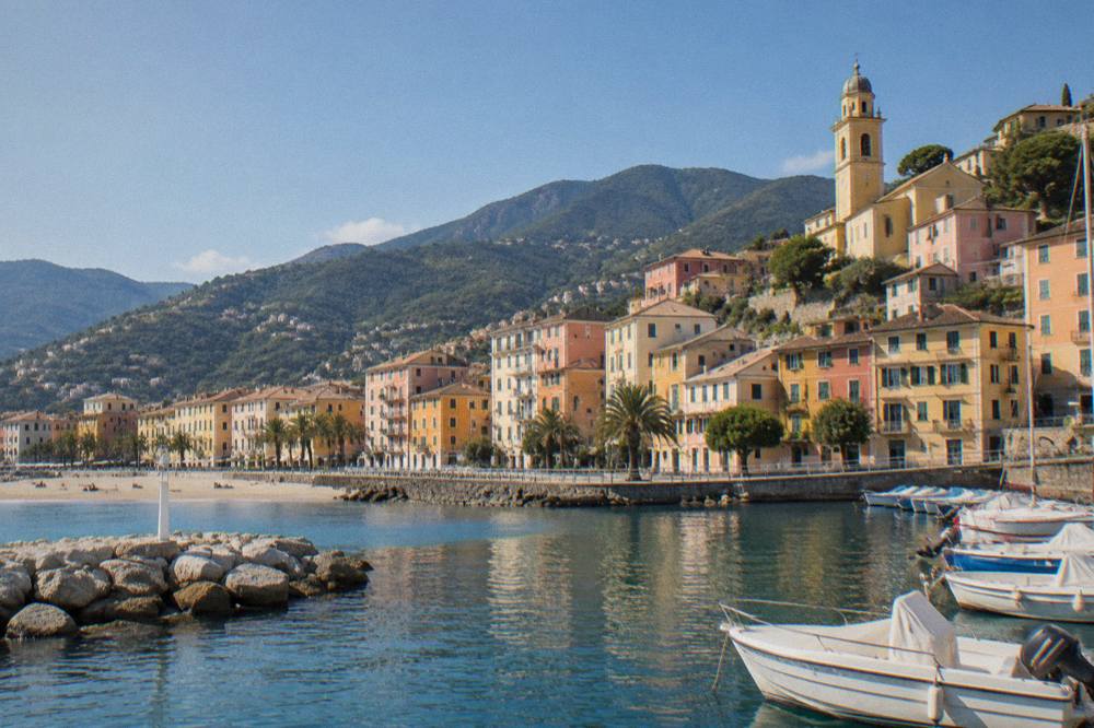 Colourful buildings above a small harbour on the Italian Riviera