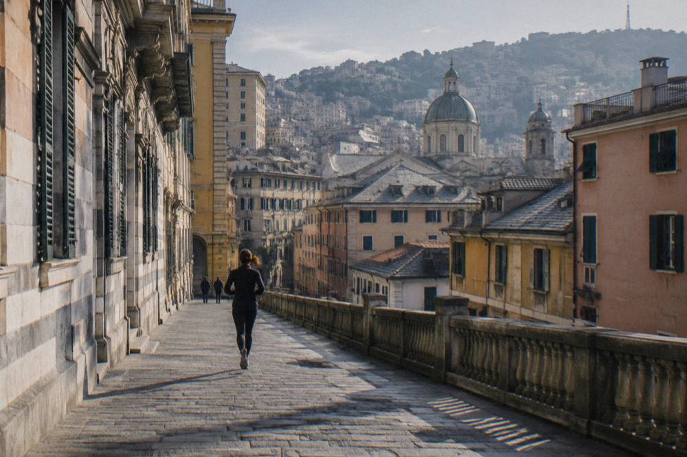 Elegant Renaissance street with striped palace facades in Genoa