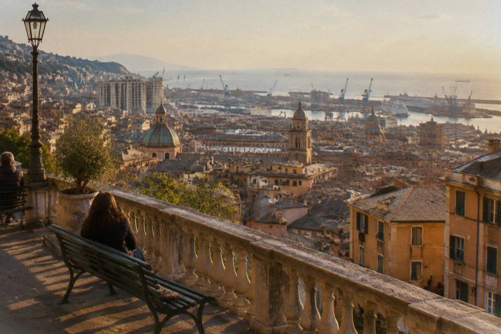 Busy Italian city square with a large fountain and classical buildings