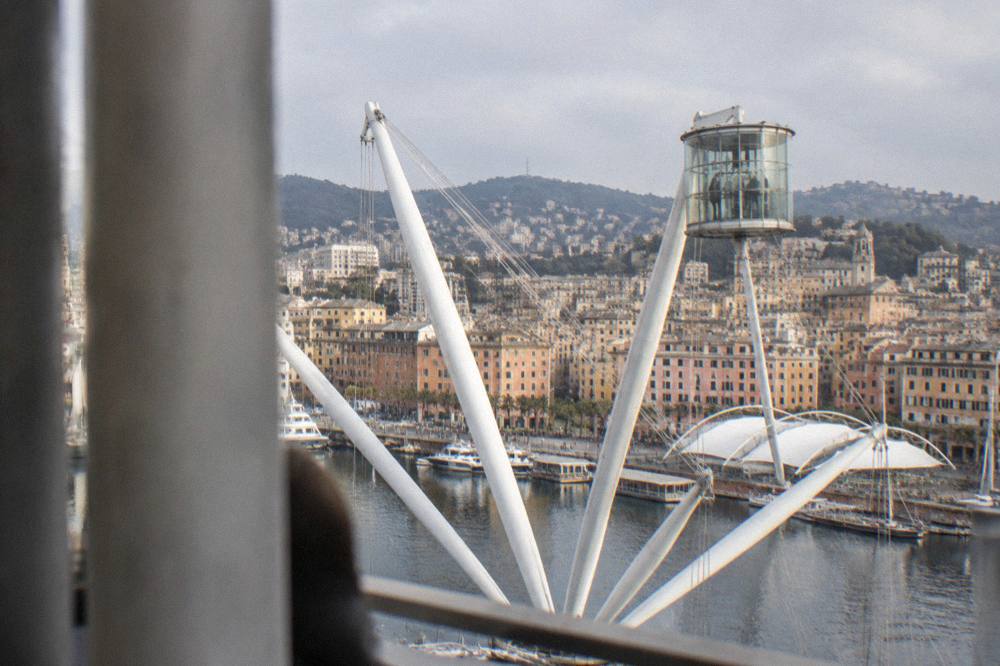 The Porto Antico waterfront in Genoa with the Bigo lift structure and harbour buildings in morning light