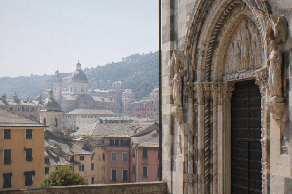 Close view of a carved stone portal on a church in Genoa