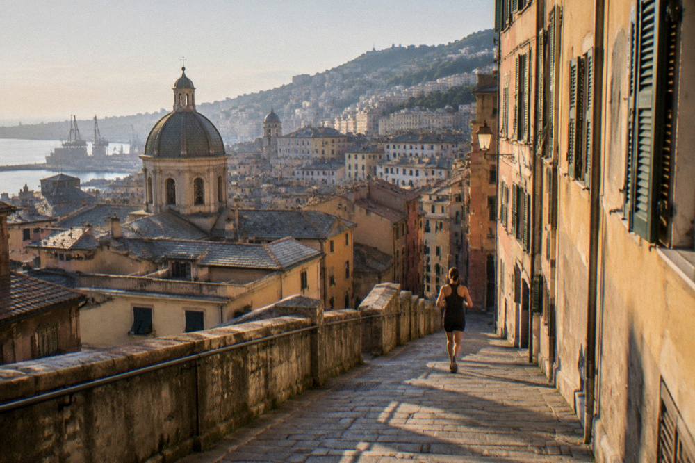 Evening view of Genoa rooftops with a church dome in the foreground