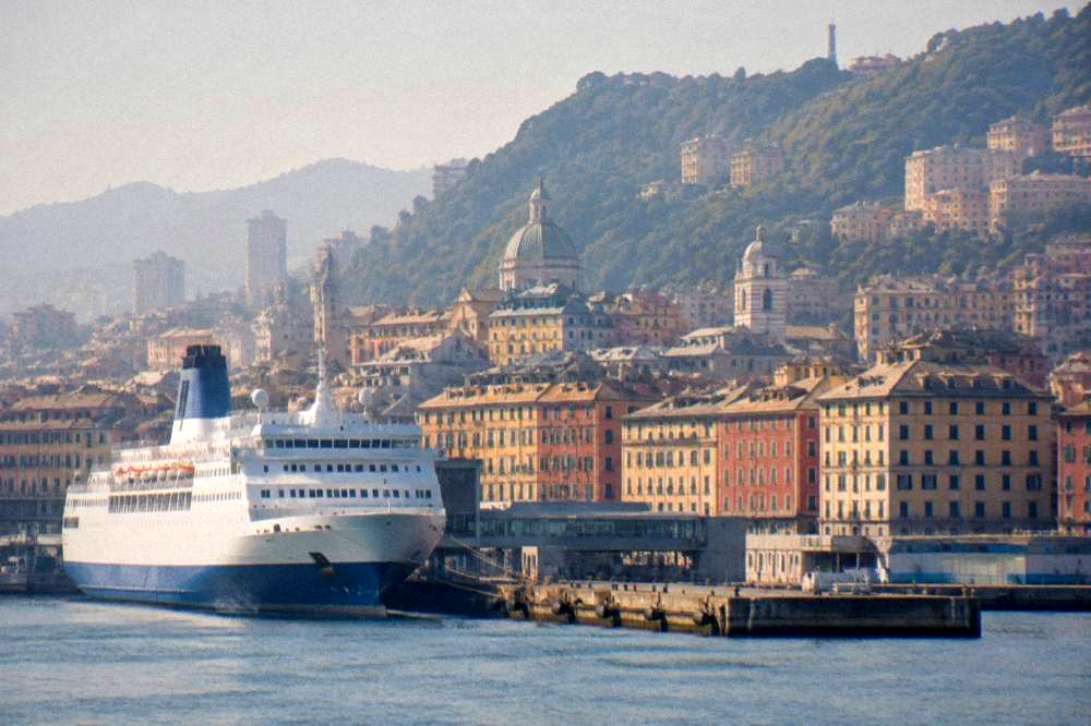 Large ferry vessel tied up at a pier in the passenger port of Genoa