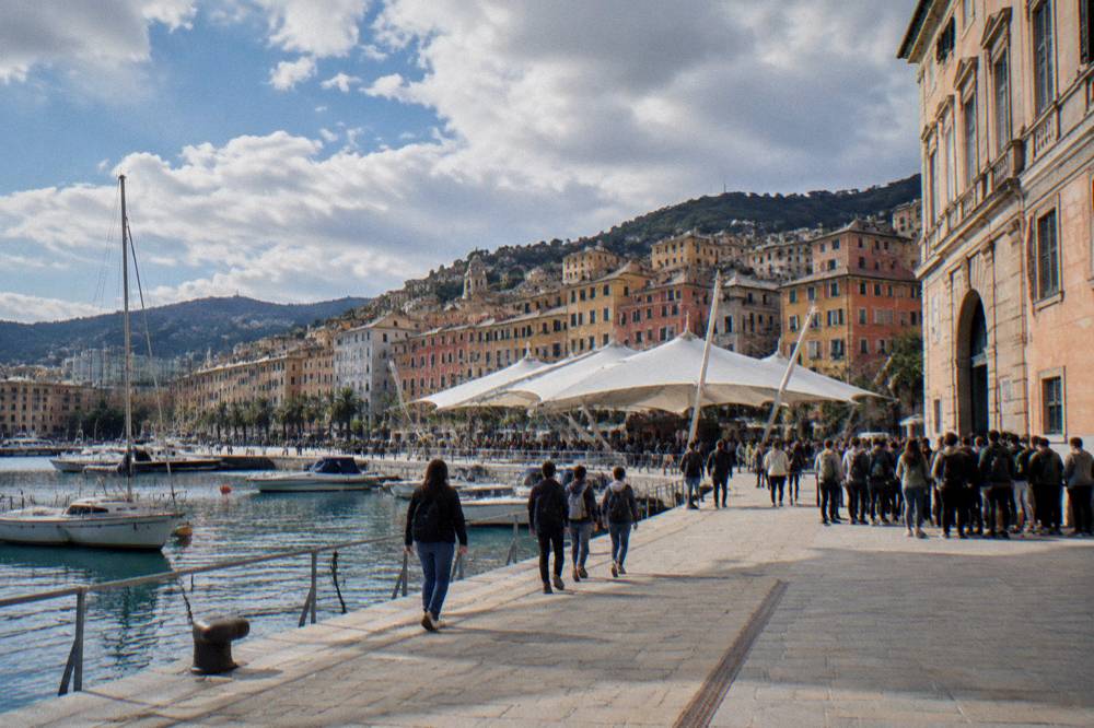 Families and students queuing outside a palazzo converted into a science festival venue