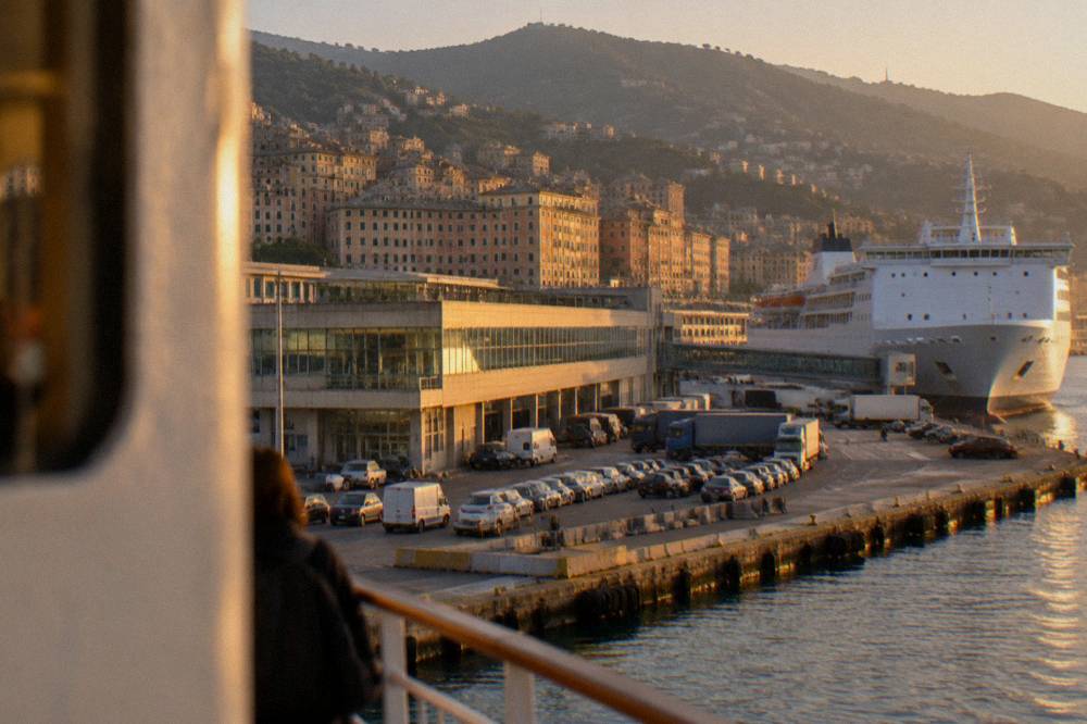 Passenger ferry approaching a colourful Ligurian coastal village