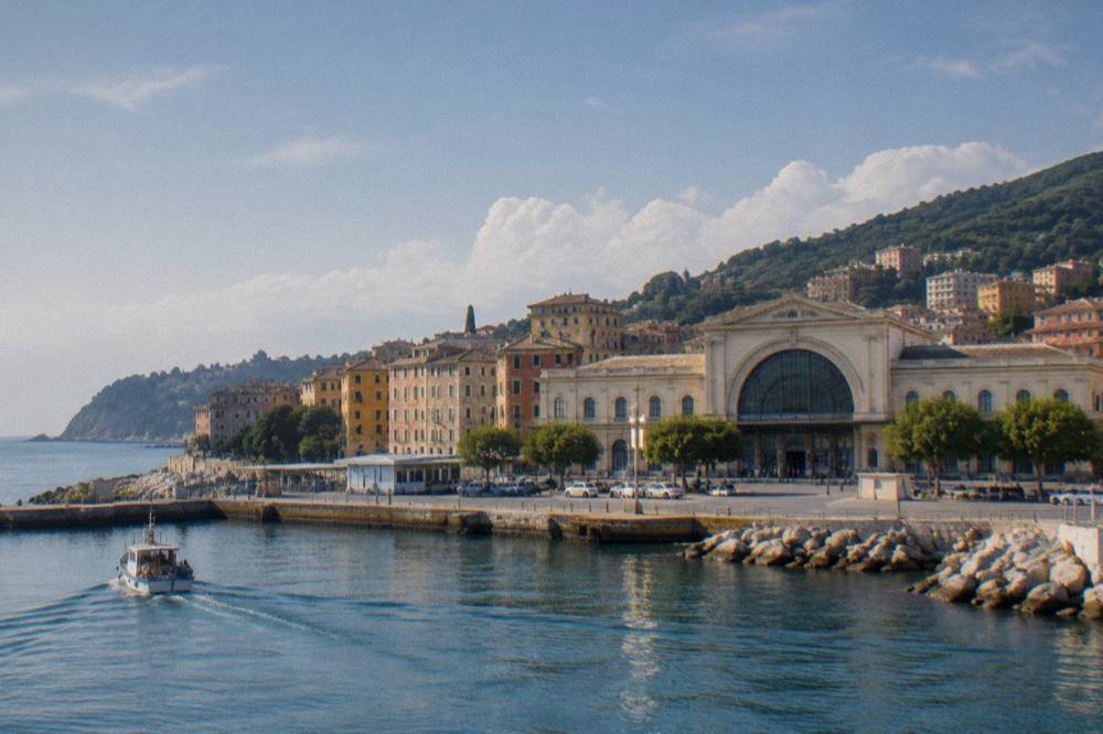 Small boat leaving a Ligurian harbour village toward wooded headland