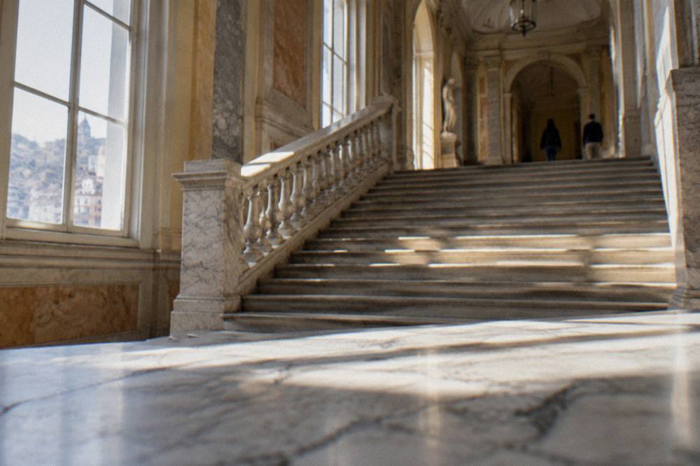 Grand staircase and marble hallway of a Genoa palace museum