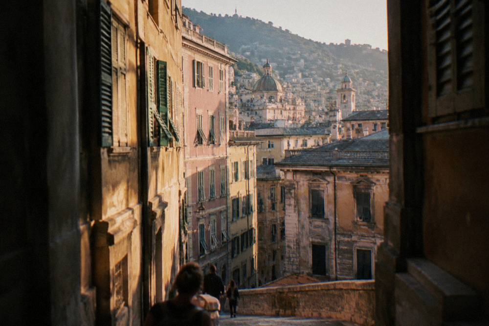 Street of Renaissance palaces in Genoa with tall facades and shuttered windows