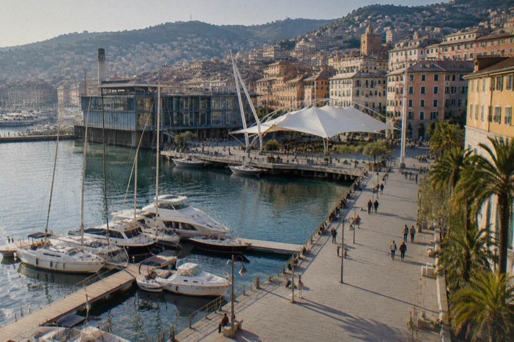 Harbour-side museum building at the Porto Antico with masts and water in view
