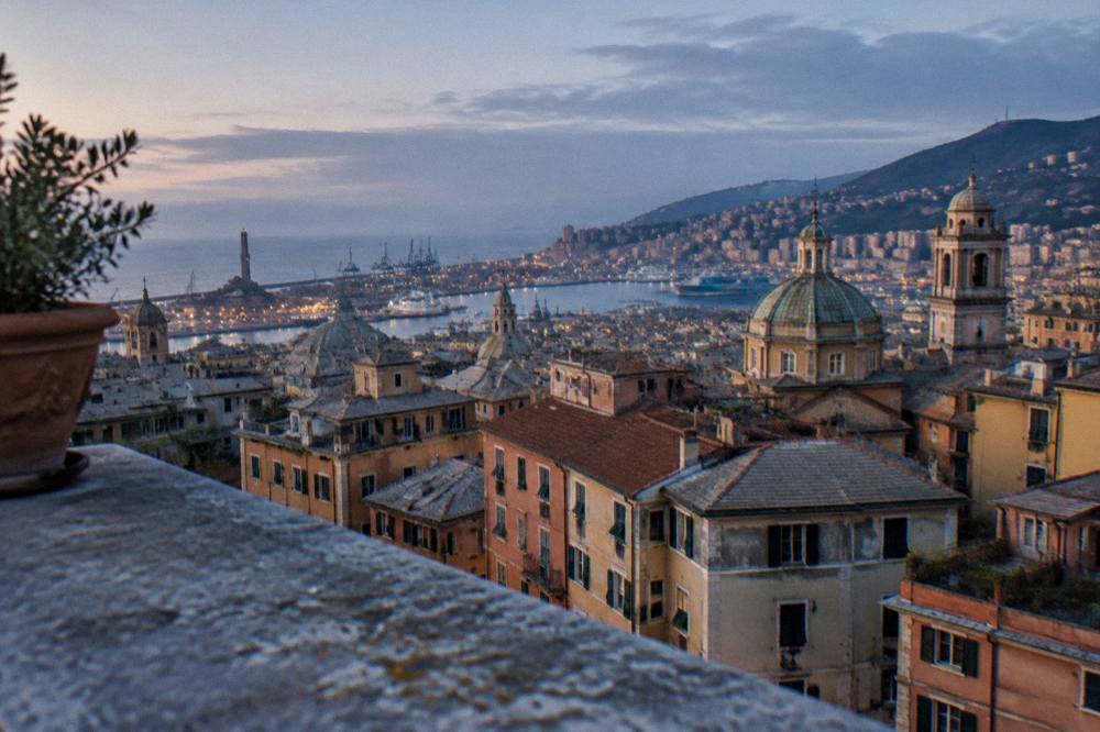 View over Genoa rooftops towards the harbour from a palace terrace
