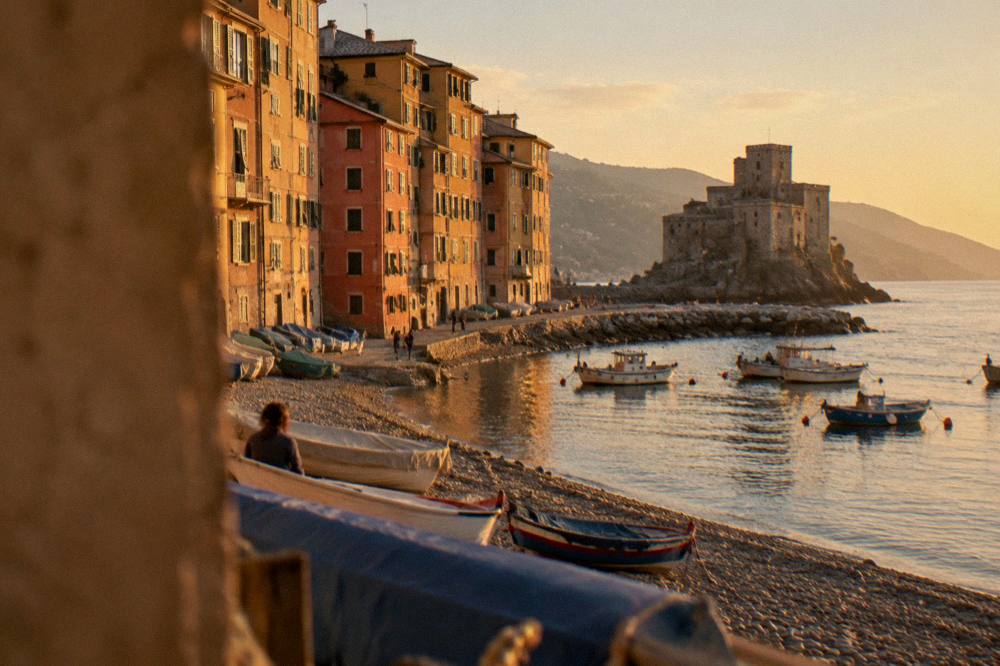 Small harbour at Camogli with pastel buildings and moored fishing boats