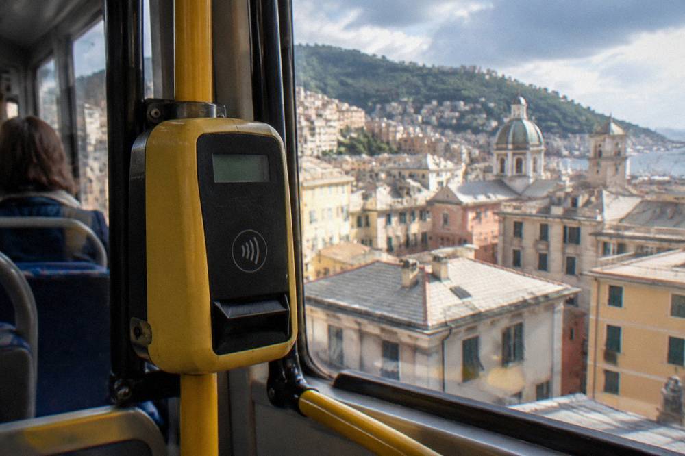 A ticket validation machine inside a Genoa public transport vehicle