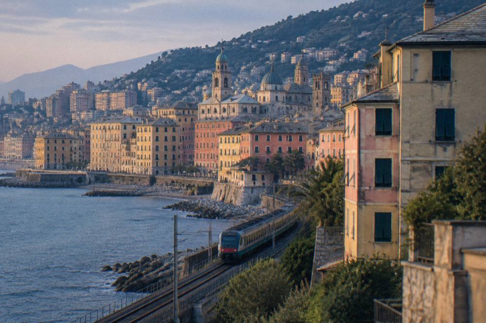 A regional train running along the Ligurian coast near Genoa