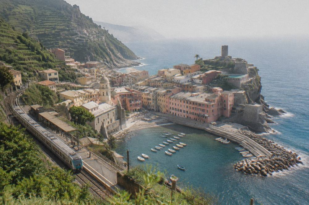 A regional train calling at a small seaside station on the Italian Riviera