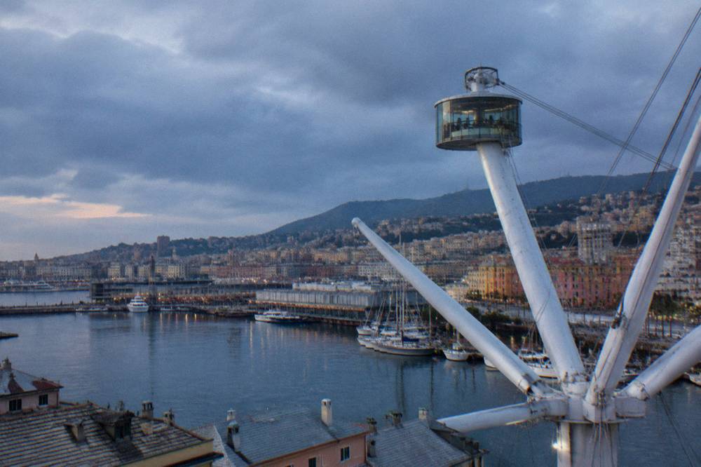Rain clouds moving over the old harbour and the Bigo lift in Genoa