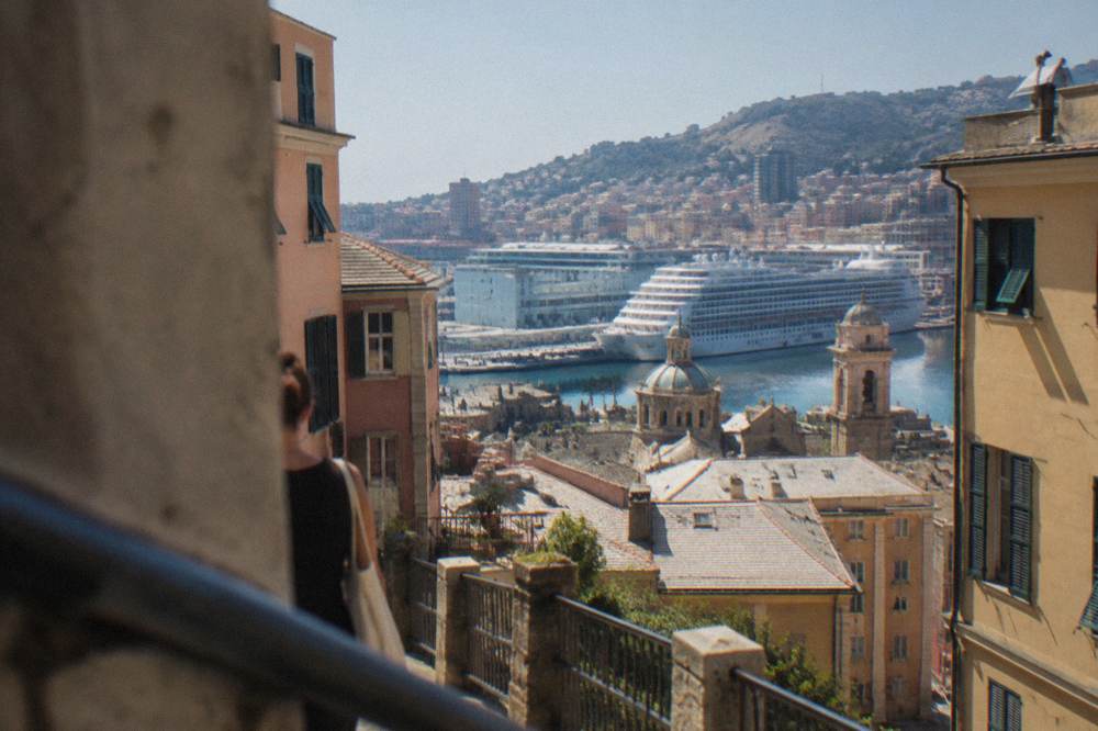 A large cruise ship docked at a Genoa passenger terminal