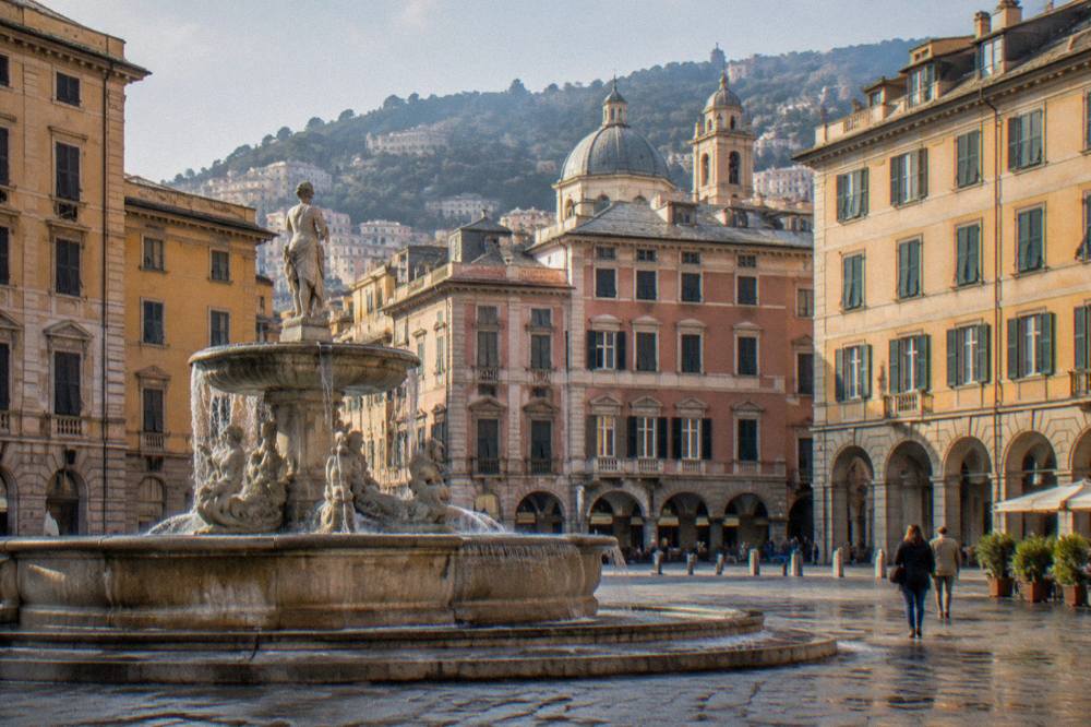 Fountain and open square in central Genoa with palazzo facades on three sides