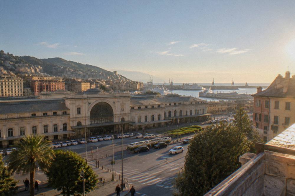 Panoramic terrace overlooking a port city with the sea stretching to the horizon