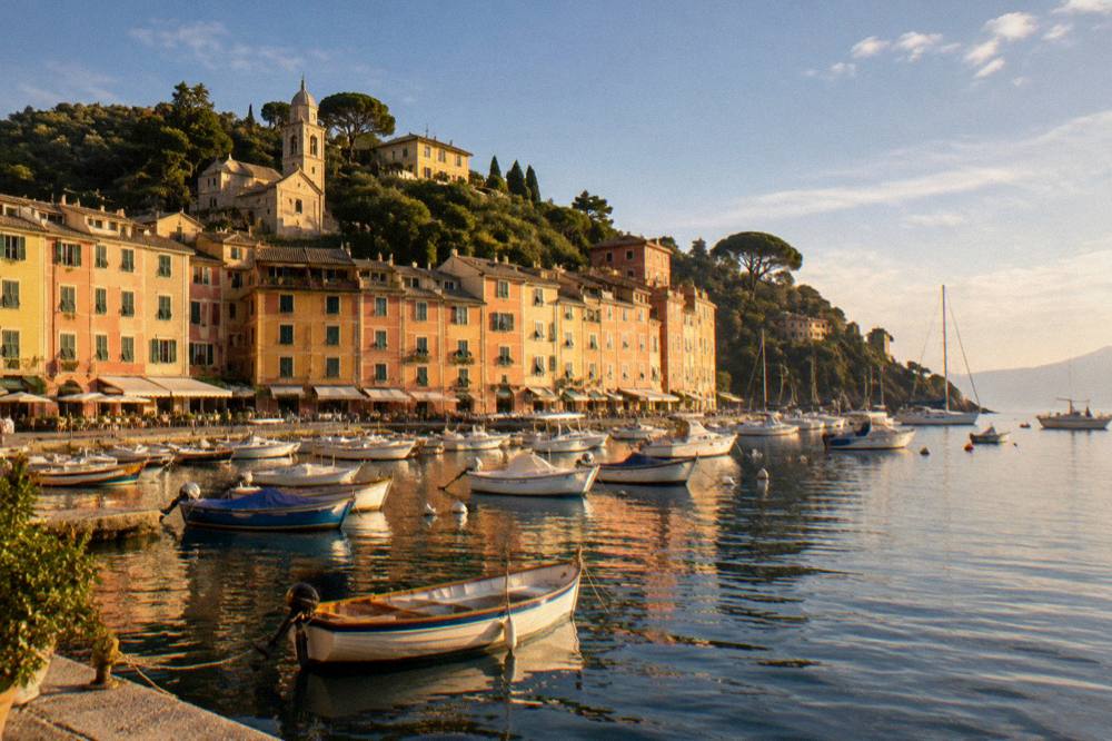 Fishing boats and coloured houses along a small harbour on the Portofino peninsula