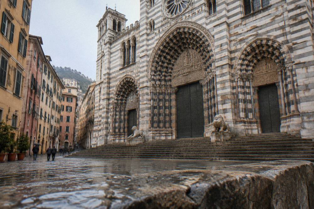 The striped facade and lions of the Cathedral of San Lorenzo in Genoa