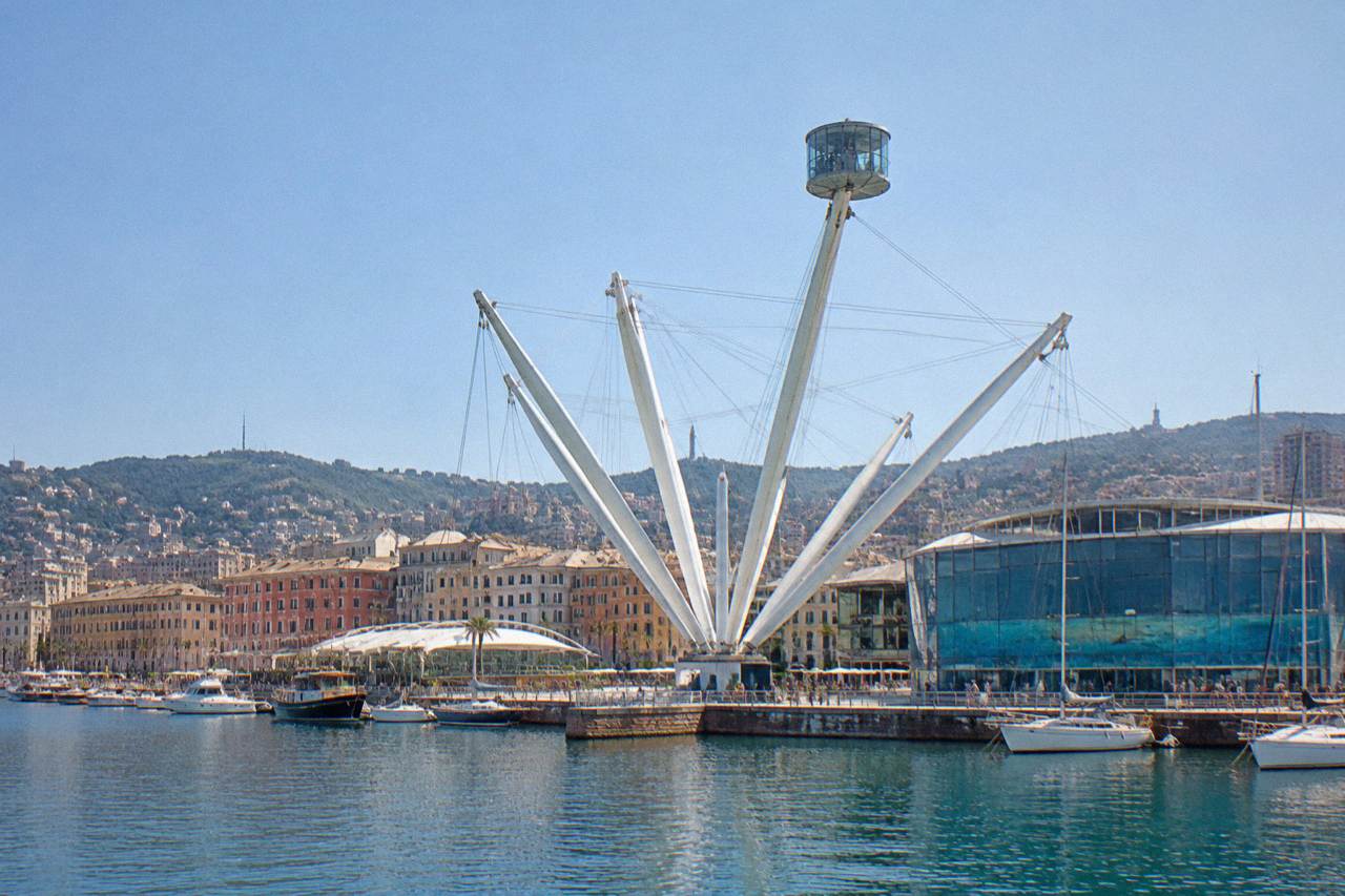 The old harbour of Genoa with the Bigo lift, the Aquarium and boats moored along the waterfront