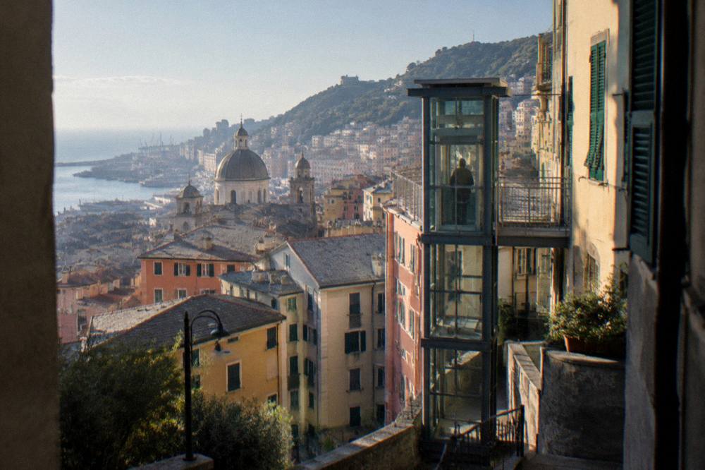 A public lift station in Genoa rising between apartment buildings on the hillside